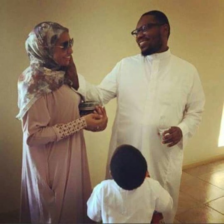 On the right side of the photo is Beanie Sigel, and on the left side of the image is his wife in the middle, his son.